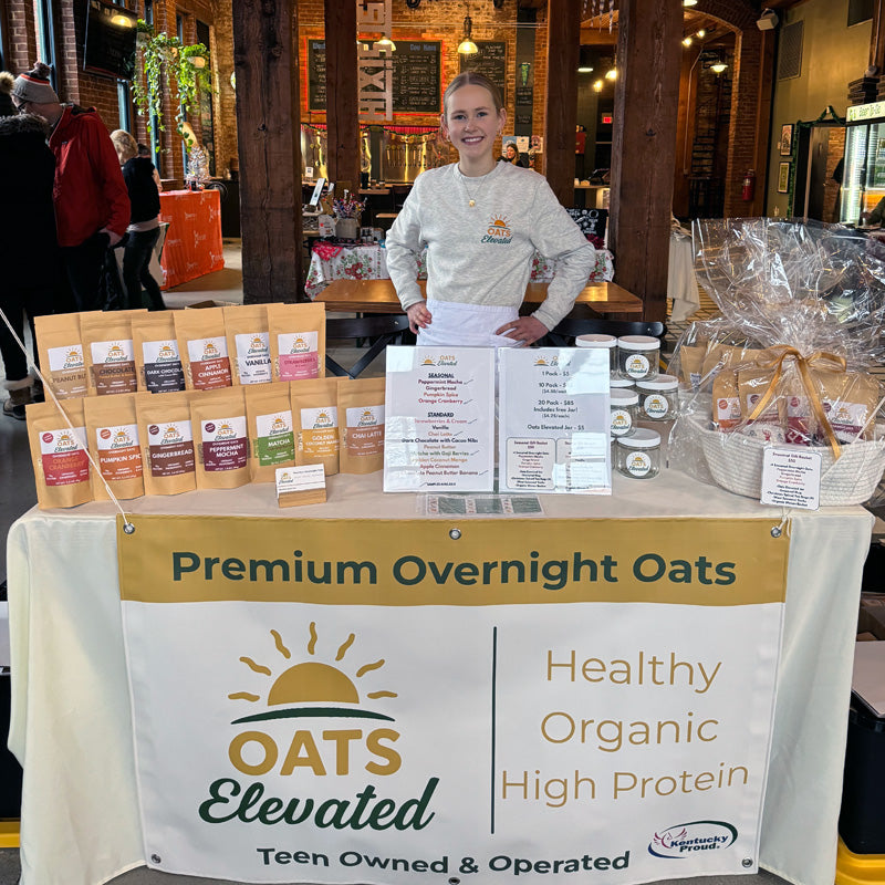 Brooke Sweeney, founder of Oats Elevated, behind her booth at one of her first indoor markets in Covington, Kentucky.