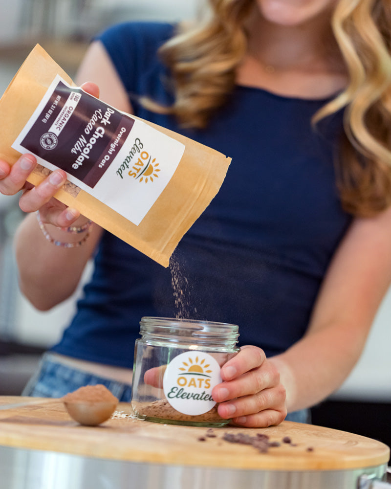 Brooke Sweeney demonstrating how to prepare overnight oats – step 1, empty the pouch into a 12-20 oz jar. 