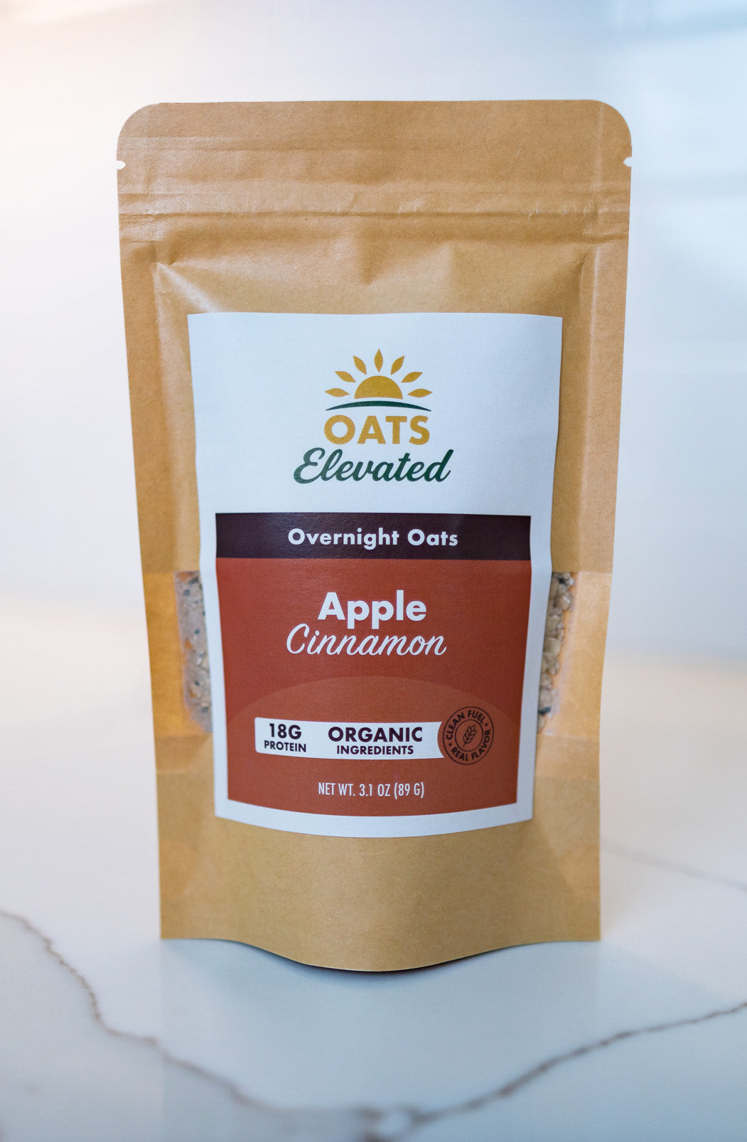 Front of package of Oats Elevated Apple Cinnamon Overnight Oats with organic ingredients, high-protein breakfast.