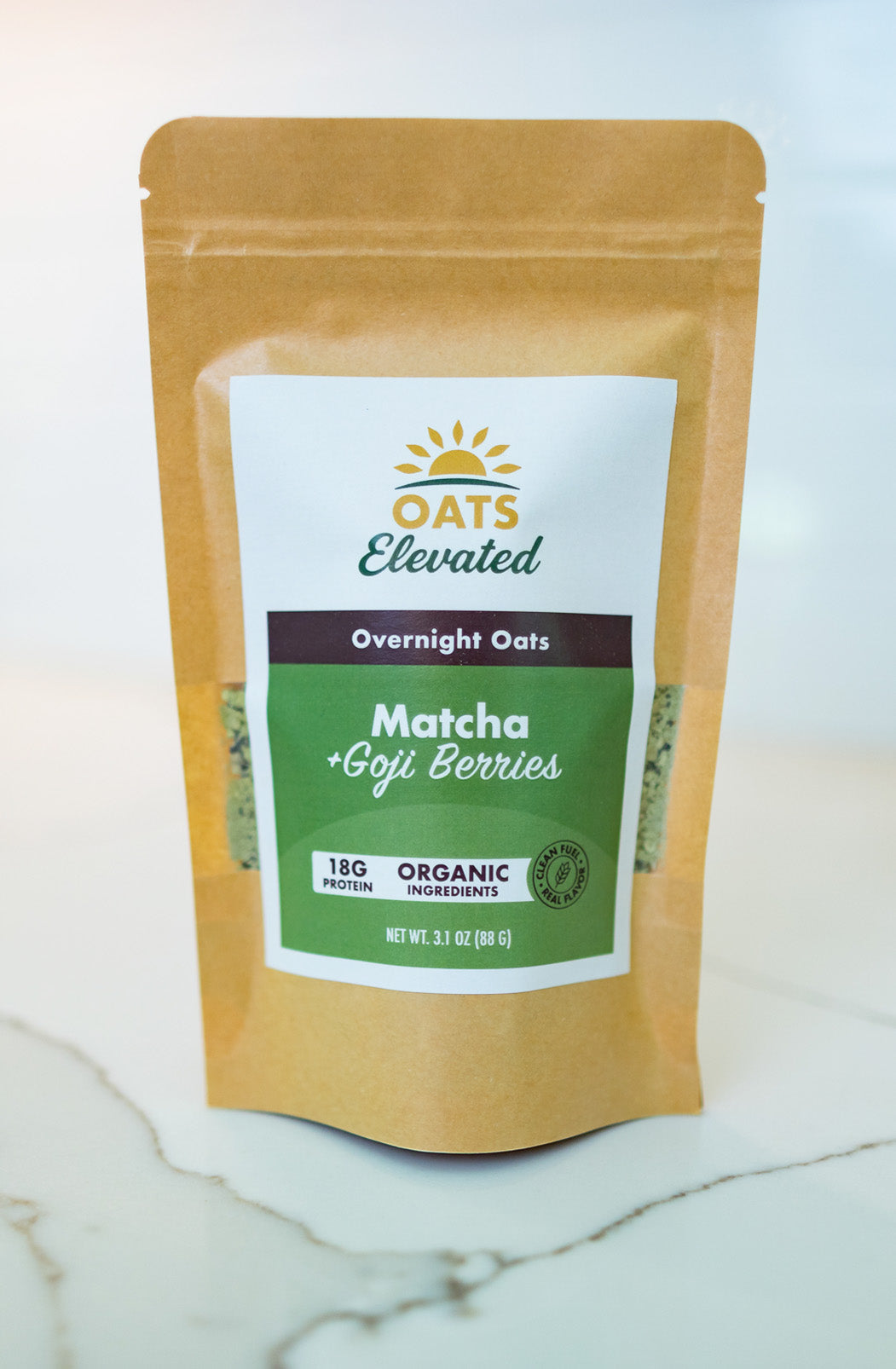 Front of package of Oats Elevated Matcha plus Goji Berries Overnight Oats with organic ingredients, high-protein breakfast.