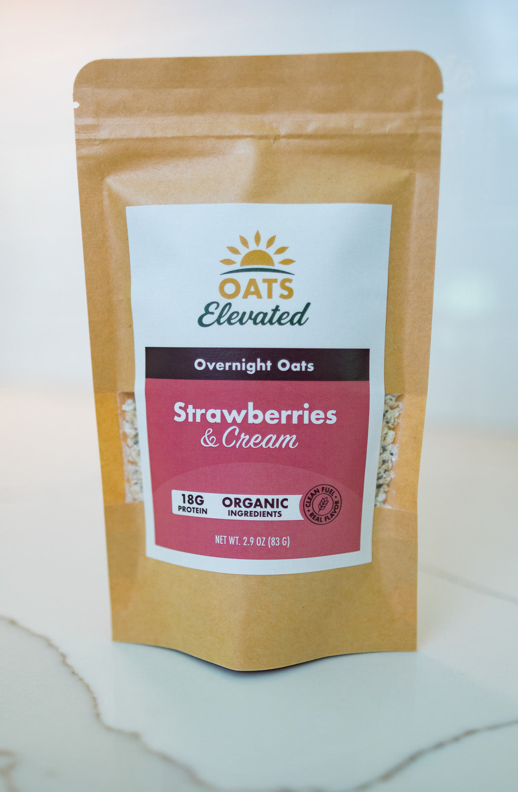 Front of package of Oats Elevated Strawberries & Cream Overnight Oats with organic ingredients, high-protein breakfast.